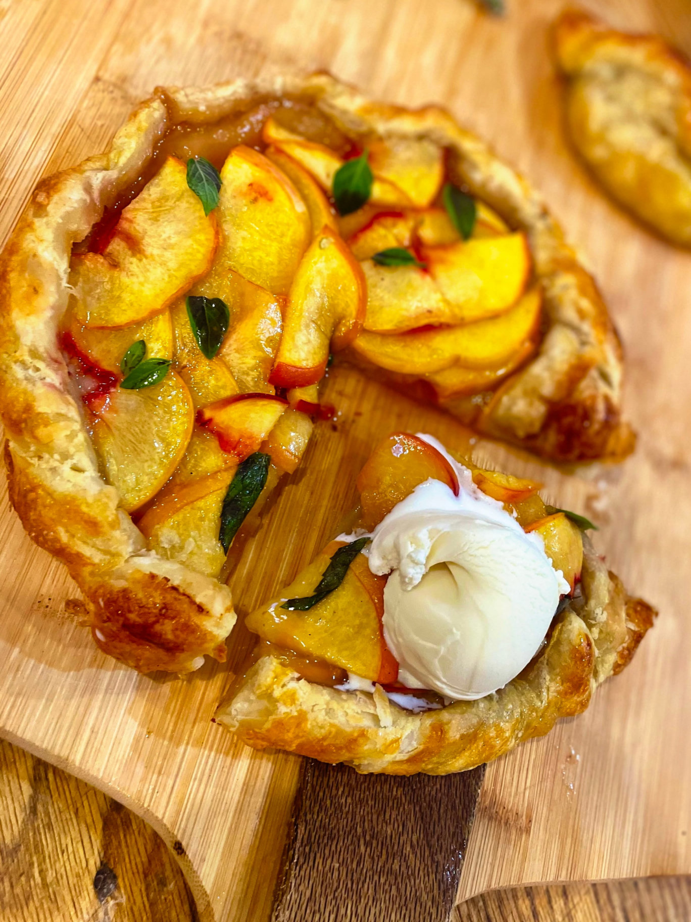 Fresh peach galette served with vanilla ice cream